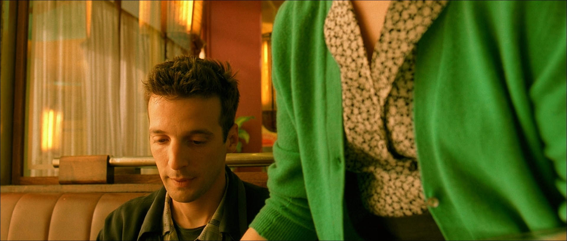 Amélie shot 1299 at 02:36:36:08: a more strongly coloured frame that also reads as a analogous arrangement, less purely.