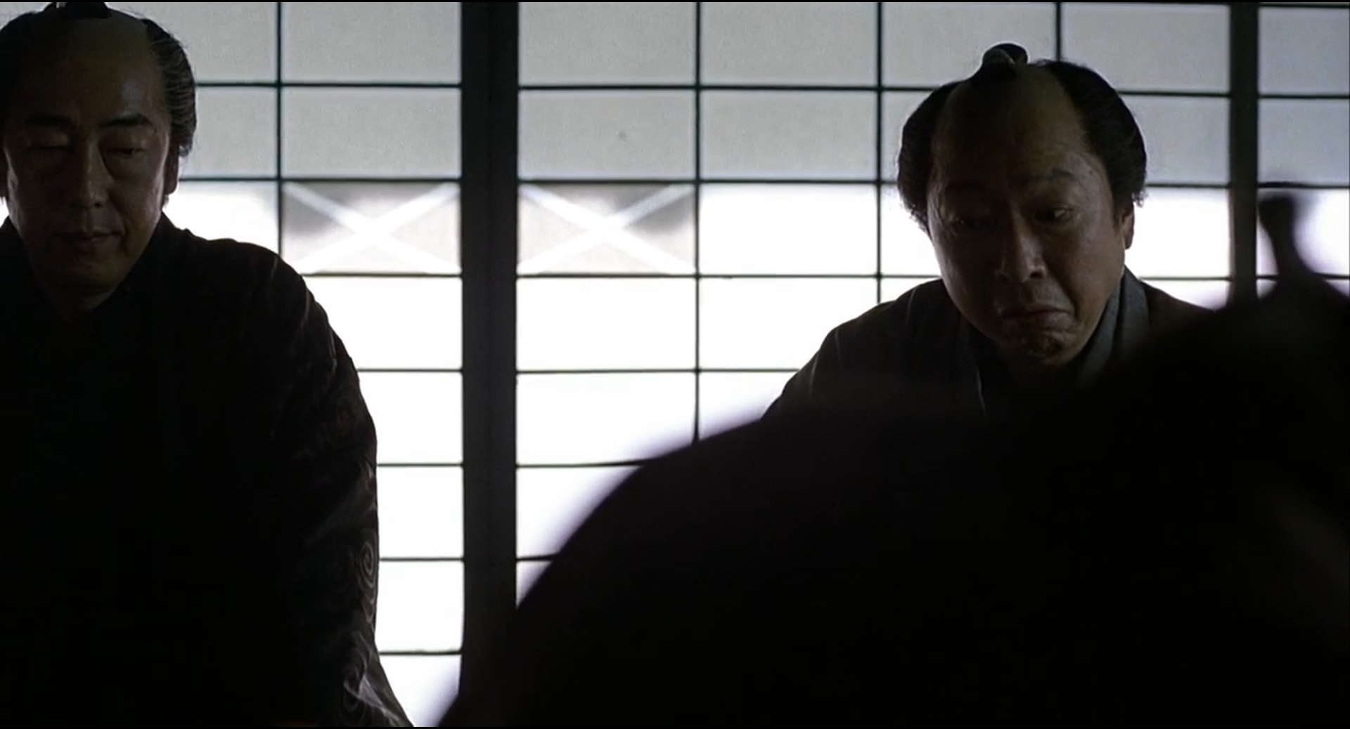 Zatoichi shot 0124 at 01:17:15:12: the same achromatic arrangement in a third film, photographed and graded by other hands.
