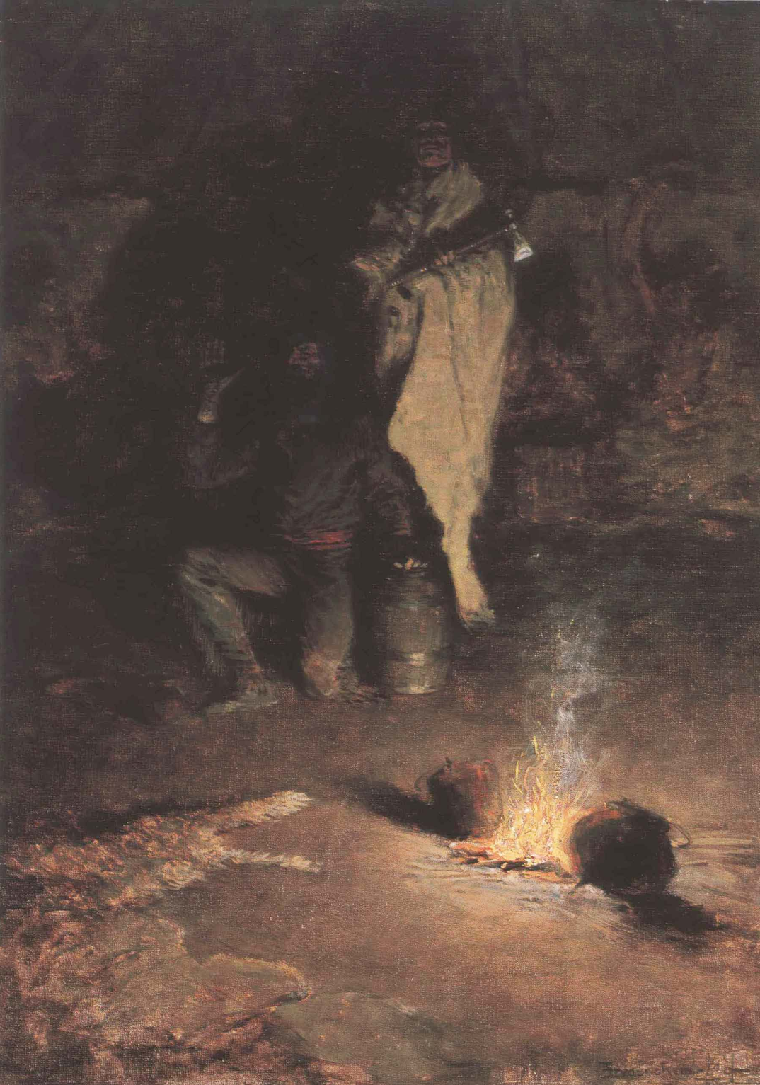 A standing figure in a pale blanket beside a small campfire under a rock face at night.
